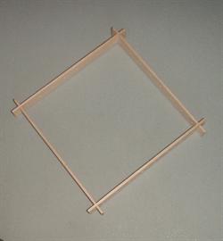 Wooden frame with drill holes
